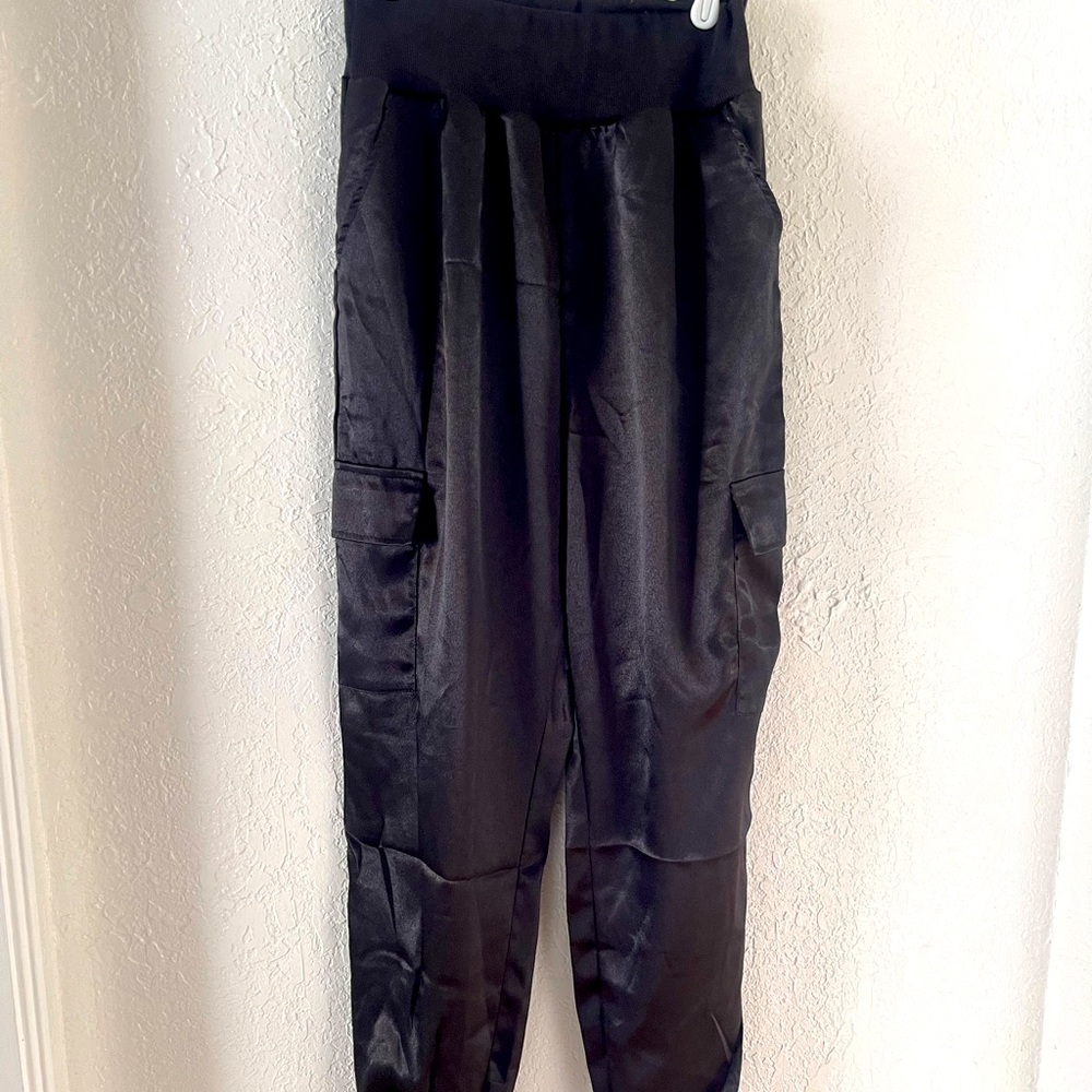 Satin jogger with pockets and side pockets on each leg.  Never worn